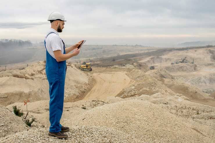 Earthmoving equipment grading a development site