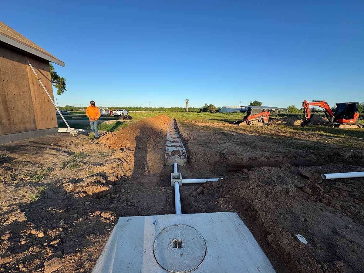 Excavation equipment and crew working on a Central Valley site